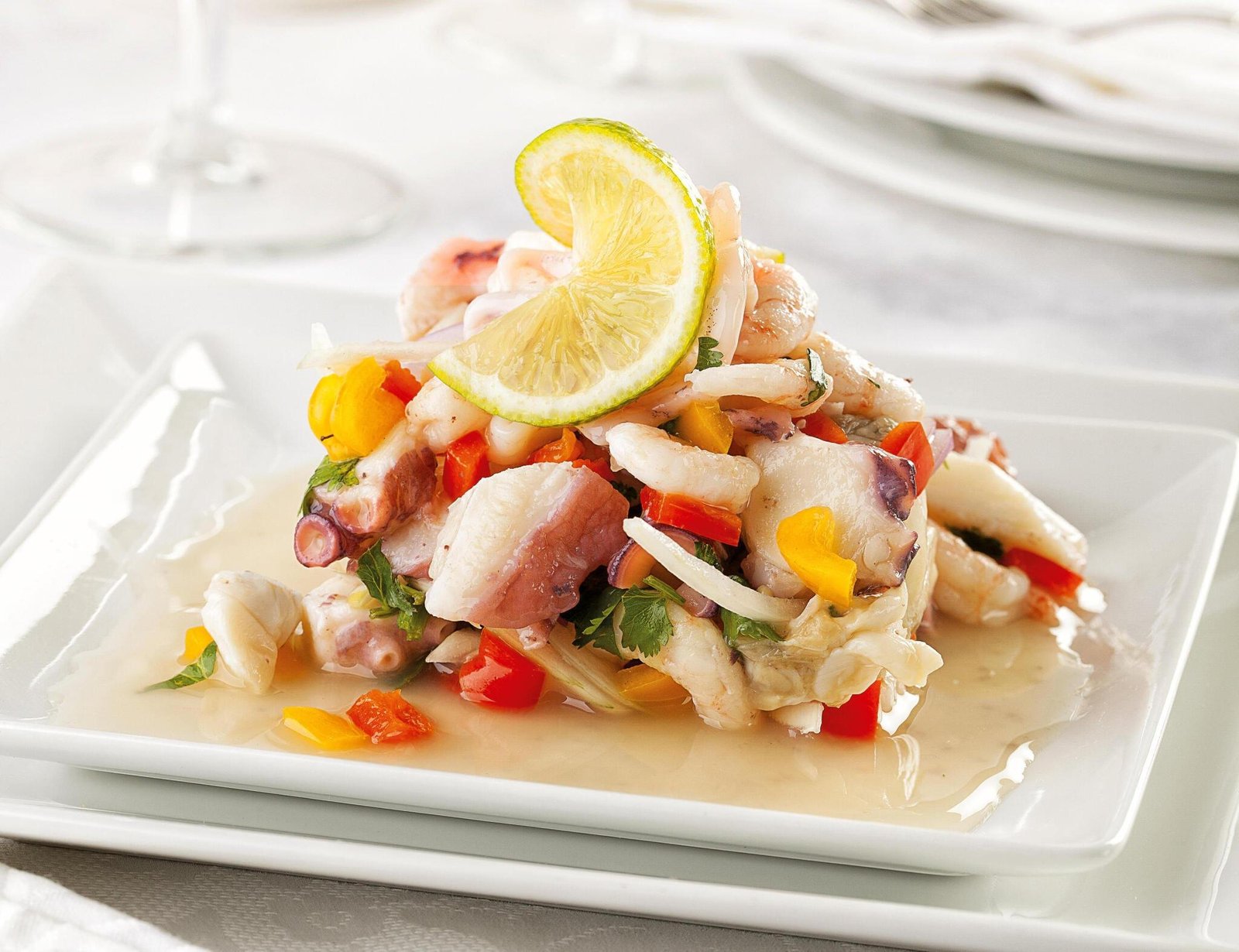 Delicious ACL Recipe Peru : Seafood Ceviche served on white plate