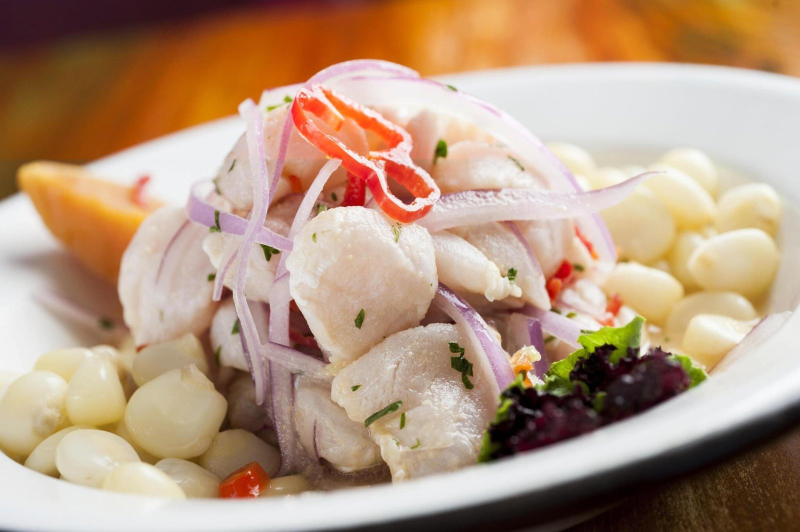 A delicious plate of scallop and peruvian corn Ceviche