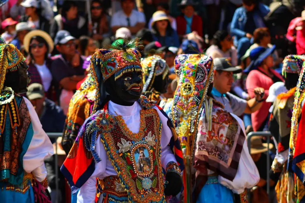 Historical peru cusco dance with a dancer in the centre of the picture