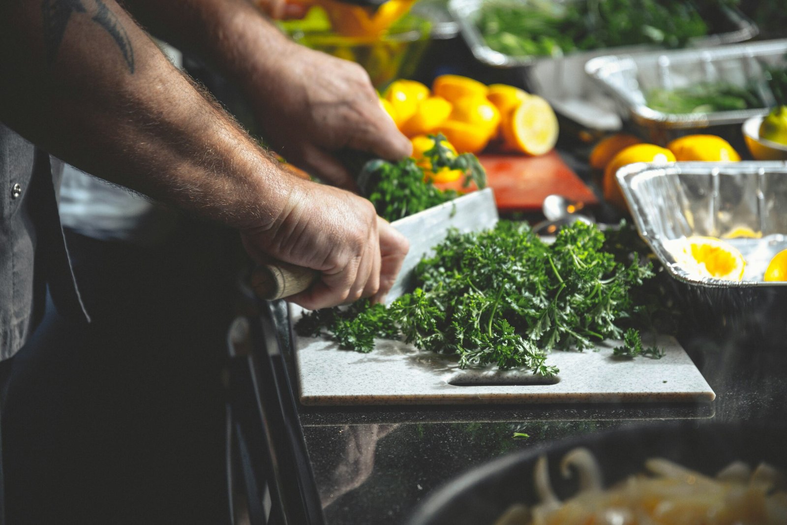 75 hard meal prep: a man is cutting vegetables to prepare meals.